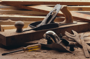 Image of woodworking tools with sawdust.