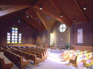 Our Savior's United Methodist Church interior view with brick walls and wood slats ceiling